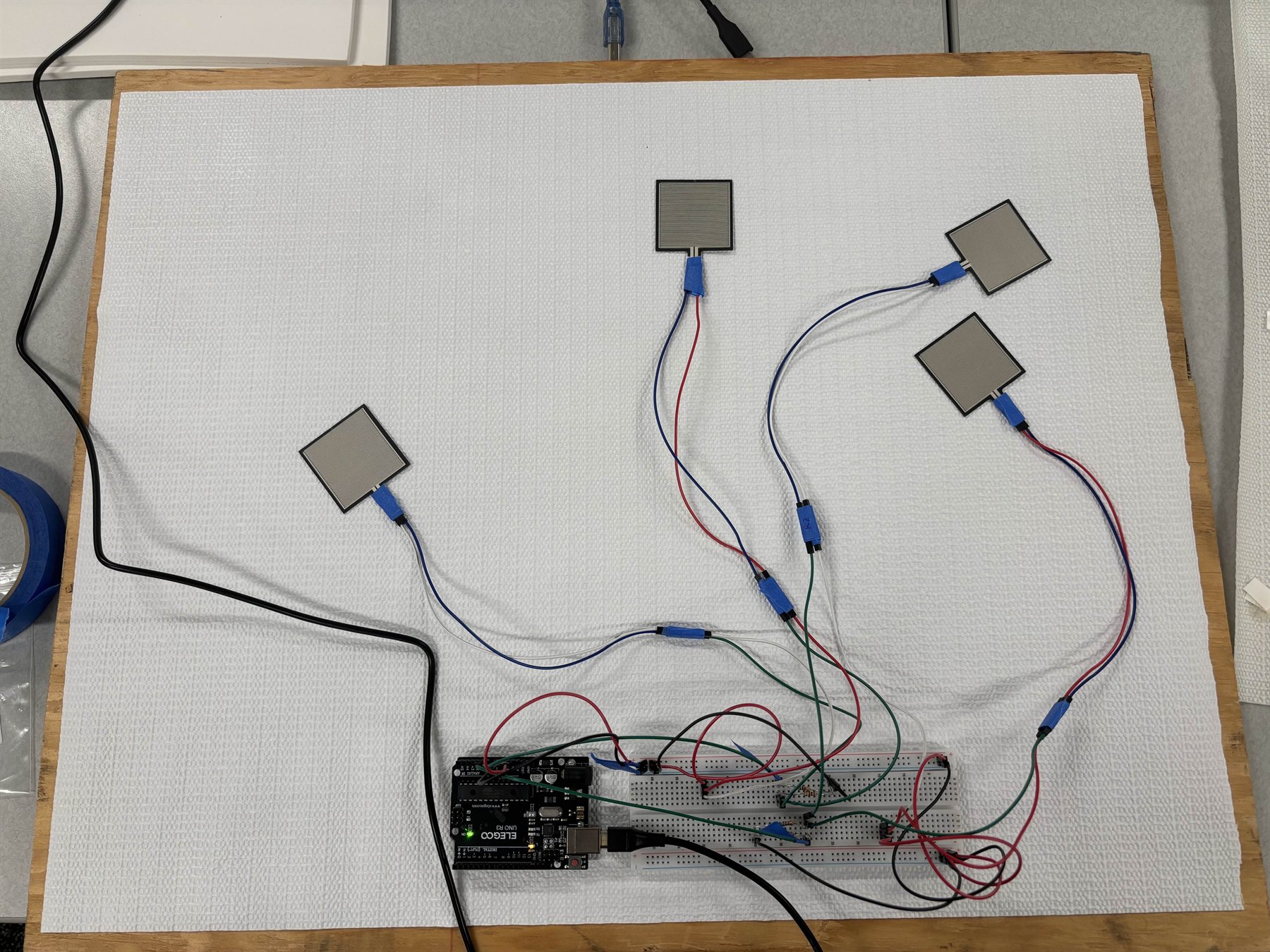 ReBalance FSR board prototype with wired pressure sensors and microcontroller